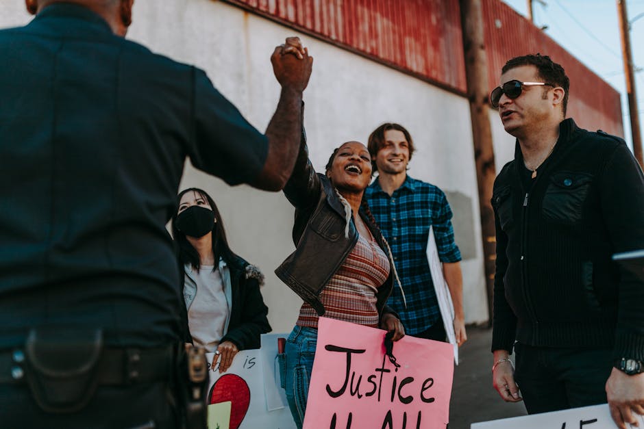 A diverse group of activists engaged in a passionate discussion, representing the challenges of building solidarity